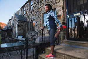 Erika stretching before a run